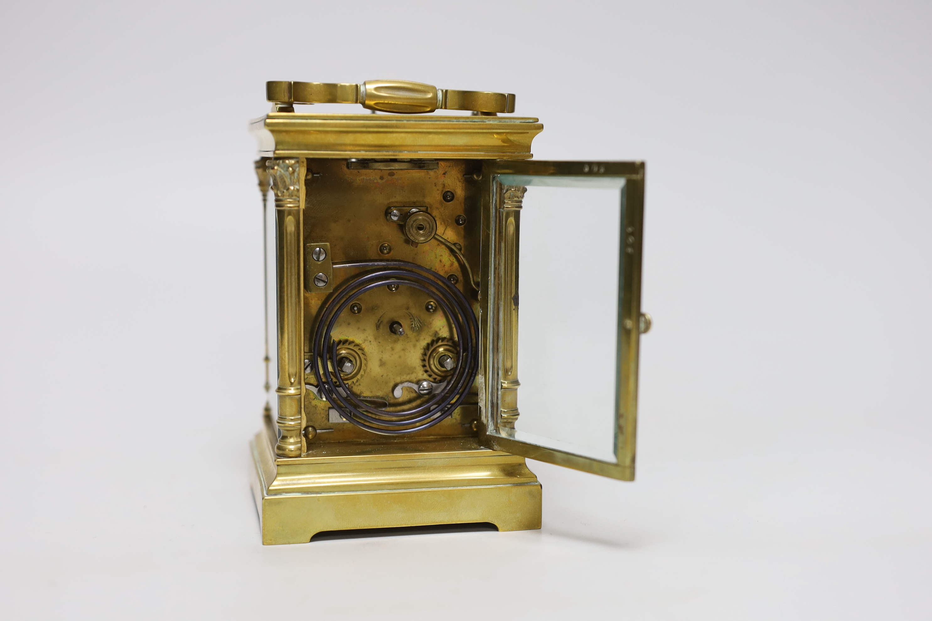 An early 20th century brass repeating carriage clock with silvered dial, 16cm high
